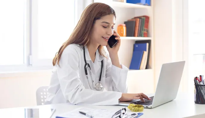 three healthcare professionals having a discussion