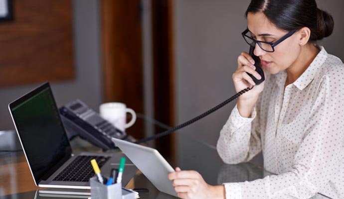 an office executive providing services over the phone